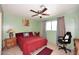 Cozy bedroom with an updated ceiling fan, neutral walls, and tiled floors at 2619 W Lamar Rd, Phoenix, AZ 85017