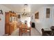 Bright dining room features a decorative chandelier and a wooden hutch for storing dinnerware at 2619 W Lamar Rd, Phoenix, AZ 85017