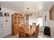Light-filled dining room boasts a wooden hutch, a decorative chandelier, and a large window at 2619 W Lamar Rd, Phoenix, AZ 85017
