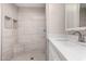 Updated bathroom with sleek white vanity and tiled shower featuring a built-in niche at 2650 W Union Hills Dr # 350, Phoenix, AZ 85027
