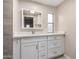 Bathroom vanity with sleek countertop, modern faucet, and mirrored cabinet for storage solutions at 2650 W Union Hills Dr # 350, Phoenix, AZ 85027