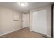 Bedroom features open doorway, closet, laminate flooring, and neutral walls at 2650 W Union Hills Dr # 350, Phoenix, AZ 85027