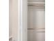 Bright, empty closet with white walls and dual wooden rods provides optimal storage space at 2650 W Union Hills Dr # 350, Phoenix, AZ 85027