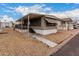 Cozy home with a covered porch and steps leading to the entrance, enhanced by gravel landscaping at 2650 W Union Hills Dr # 350, Phoenix, AZ 85027