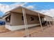 A single-story home featuring a covered carport, exterior windows, and modern architecture at 2650 W Union Hills Dr # 350, Phoenix, AZ 85027