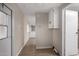 Hallway with white cabinetry leading to kitchen and bathroom, showcasing bright and airy design at 2650 W Union Hills Dr # 350, Phoenix, AZ 85027