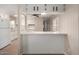 Kitchen with white cabinets, a pass-through bar, and ample counter space at 2650 W Union Hills Dr # 350, Phoenix, AZ 85027