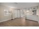 Open-concept living room with wood flooring, natural light, and seamless flow to the kitchen at 2650 W Union Hills Dr # 350, Phoenix, AZ 85027