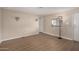 Empty living room with laminate floors, window, and neutral walls at 2650 W Union Hills Dr # 350, Phoenix, AZ 85027