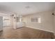 Bright living room featuring wood flooring, window views, and an open layout to the kitchen at 2650 W Union Hills Dr # 350, Phoenix, AZ 85027