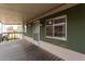 Inviting covered porch features durable wood flooring and exterior paint at 2650 W Union Hills Dr # 350, Phoenix, AZ 85027