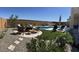 Desert backyard with a hammock, swimming pool, patio furniture, and drought resistant plants at 26904 W Kerry Ln, Buckeye, AZ 85396