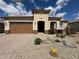 Beautiful single-story home with desert landscaping, a tiled roof, and a spacious two-car garage at 26904 W Kerry Ln, Buckeye, AZ 85396