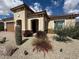 Charming single-story home with desert landscaping, a tiled roof, and a two-car garage at 26904 W Kerry Ln, Buckeye, AZ 85396