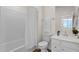 Clean bathroom featuring a shower-tub combo and a vanity with ample counter space at 2765 S Cavalier Dr # 102, Gilbert, AZ 85295