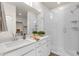 Modern bathroom featuring a quartz countertop vanity and glass enclosed shower with white subway tile at 2765 S Cavalier Dr # 102, Gilbert, AZ 85295