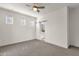 Large bedroom with attached bathroom, ample natural light, and ceiling fan at 2765 S Cavalier Dr # 102, Gilbert, AZ 85295