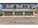 View of garages, showing three car spaces with traditional doors and architectural features at 2765 S Cavalier Dr # 102, Gilbert, AZ 85295