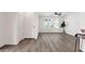 Bright living room featuring hardwood flooring, arched windows, and contemporary decor at 2765 S Cavalier Dr # 102, Gilbert, AZ 85295