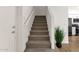 Carpeted staircase leading to upper level of the home at 2765 S Cavalier Dr # 102, Gilbert, AZ 85295