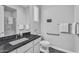 Accessible bathroom featuring a granite countertop sink, and handrails for safety at 2854 E Cashman Dr, Phoenix, AZ 85050