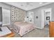 Comfortable bedroom with carpet, a full bed, and decorative quilt hanging on the wall at 2854 E Cashman Dr, Phoenix, AZ 85050