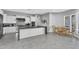 Spacious kitchen with white cabinetry, granite countertops, stainless steel appliances, and dining area at 2854 E Cashman Dr, Phoenix, AZ 85050