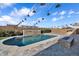 Inviting pool area with stone accents, water feature, stylish lighting, and tiled patio at 2854 E Cashman Dr, Phoenix, AZ 85050