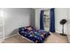 Bedroom featuring neutral walls, carpeting, and a window with privacy curtains at 3037 W Libby St, Phoenix, AZ 85053
