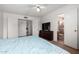Bright bedroom featuring carpet, ceiling fan, and an ensuite bathroom with a shower at 3037 W Libby St, Phoenix, AZ 85053