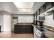 Bright kitchen featuring granite countertops and views of the backyard at 3037 W Libby St, Phoenix, AZ 85053