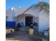 Inviting front entrance with an arched porch, stucco walls and double doors needs some TLC at 317 W Frontier St, Apache Junction, AZ 85120