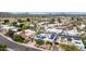 A captivating aerial view of homes with modern architecture, solar panels, and lush desert landscaping at 3258 E Vogel Ave, Phoenix, AZ 85028