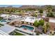Aerial view showcasing a backyard pool, desert landscaping and a mountain backdrop at 3258 E Vogel Ave, Phoenix, AZ 85028