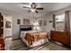 Bedroom with an open closet, a wooden chest of drawers, and a patterned bed cover at 3258 E Vogel Ave, Phoenix, AZ 85028