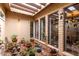 Charming interior courtyard with natural lighting, decorative plants, terracotta pots and desert accents at 3258 E Vogel Ave, Phoenix, AZ 85028