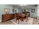 Bright dining room with hardwood floors, a modern chandelier, and seamless access to the adjacent living spaces at 3258 E Vogel Ave, Phoenix, AZ 85028