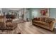 Bright living room features hardwood floors, comfortable seating, and access to the dining area for seamless entertaining at 3258 E Vogel Ave, Phoenix, AZ 85028