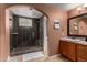 Elegant main bathroom features a walk-in shower with glass door and vanity offering a spa-like experience at 3258 E Vogel Ave, Phoenix, AZ 85028