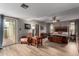 Spacious main bedroom with wood-look floors, a comfortable chair, and access to an outdoor space enhancing relaxation at 3258 E Vogel Ave, Phoenix, AZ 85028