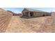 Spacious backyard featuring block wall, covered patio and desert landscaping at 33395 N 132Nd Dr, Peoria, AZ 85383