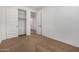 This bedroom is bright and has carpet, white walls and trim, with closet and doorway views at 33395 N 132Nd Dr, Peoria, AZ 85383