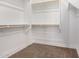 Walk in closet with carpet and multiple storage shelving and closet rods at 33395 N 132Nd Dr, Peoria, AZ 85383