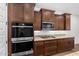 Gourmet kitchen featuring stainless steel appliances, granite countertops and modern cabinets at 33395 N 132Nd Dr, Peoria, AZ 85383