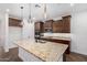 Kitchen featuring granite countertops, stainless steel appliances, and custom cabinetry at 33395 N 132Nd Dr, Peoria, AZ 85383