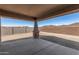 Covered patio featuring concrete flooring and brick pillars, perfect for outdoor lounging at 33395 N 132Nd Dr, Peoria, AZ 85383