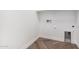 Small room with storage, wood look floors and white walls at 33395 N 132Nd Dr, Peoria, AZ 85383