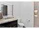 Modern bathroom with marble countertop, illuminated mirror, and herringbone tile shower at 3939 W Fox Rd, Laveen, AZ 85339