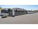 Gated home featuring a black horizontal slat fence with white pillars at 3939 W Fox Rd, Laveen, AZ 85339