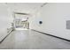 Large garage interior with insulated door and ample workspace at 3939 W Fox Rd, Laveen, AZ 85339